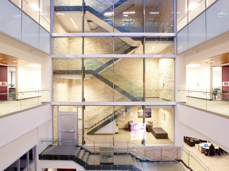 A multiple floor staircase encased in glass